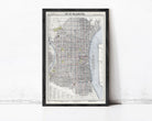 The image is a framed map of Philadelphia, Pennsylvania, depicting the city's streets, landmarks, and surrounding areas.