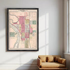 The image is a framed map of the city of Wichita, Kansas, depicting the layout of the city with streets, buildings, and other landmarks.