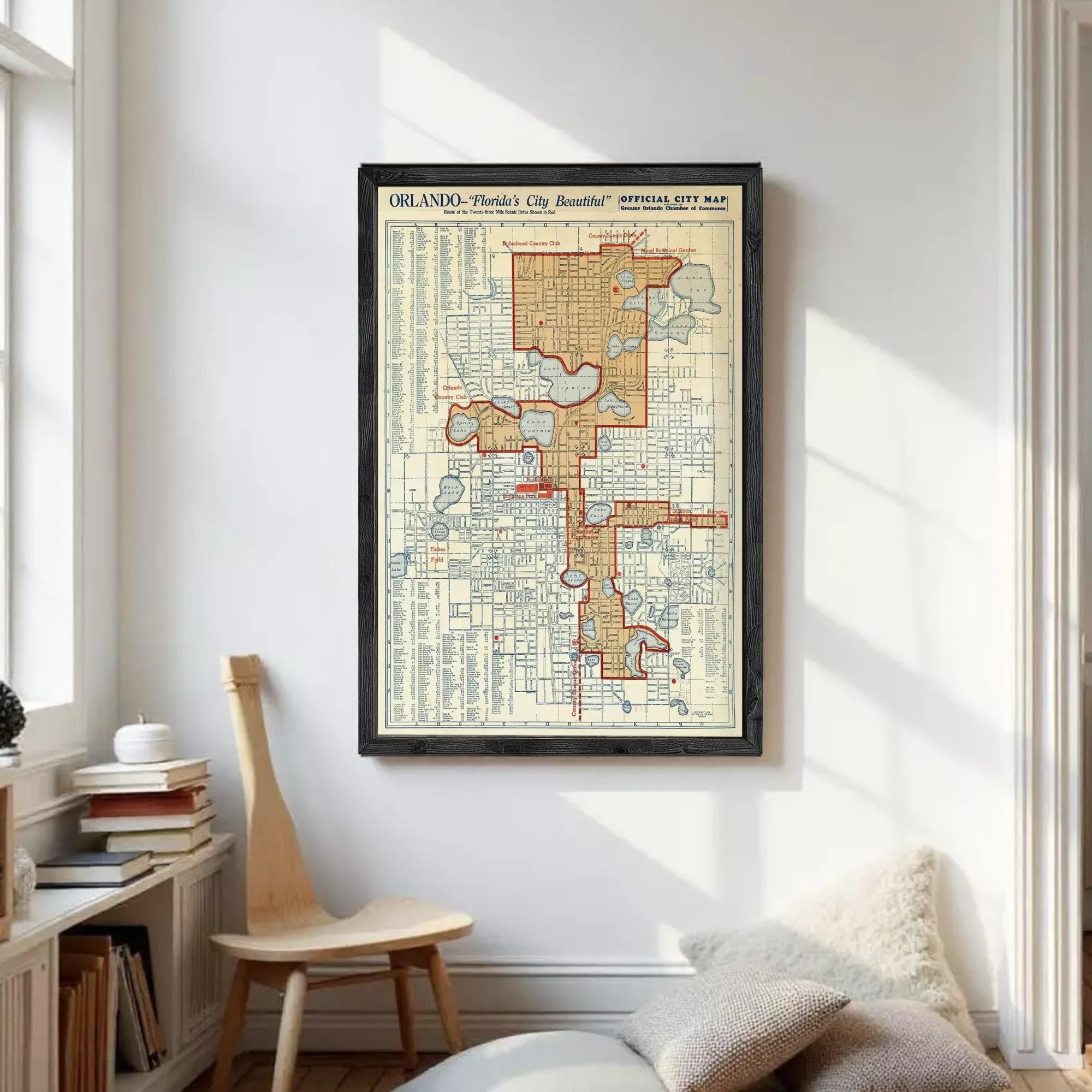 The image is a framed vintage map of Orlando, Florida, depicting the city's layout and streets.