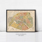 The image is a framed vintage map of Paris, France, depicting the city's streets and neighborhoods in a detailed and colorful manner.