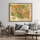 a large framed map of the state of Oklahoma hanging on a wall in a living room setting.