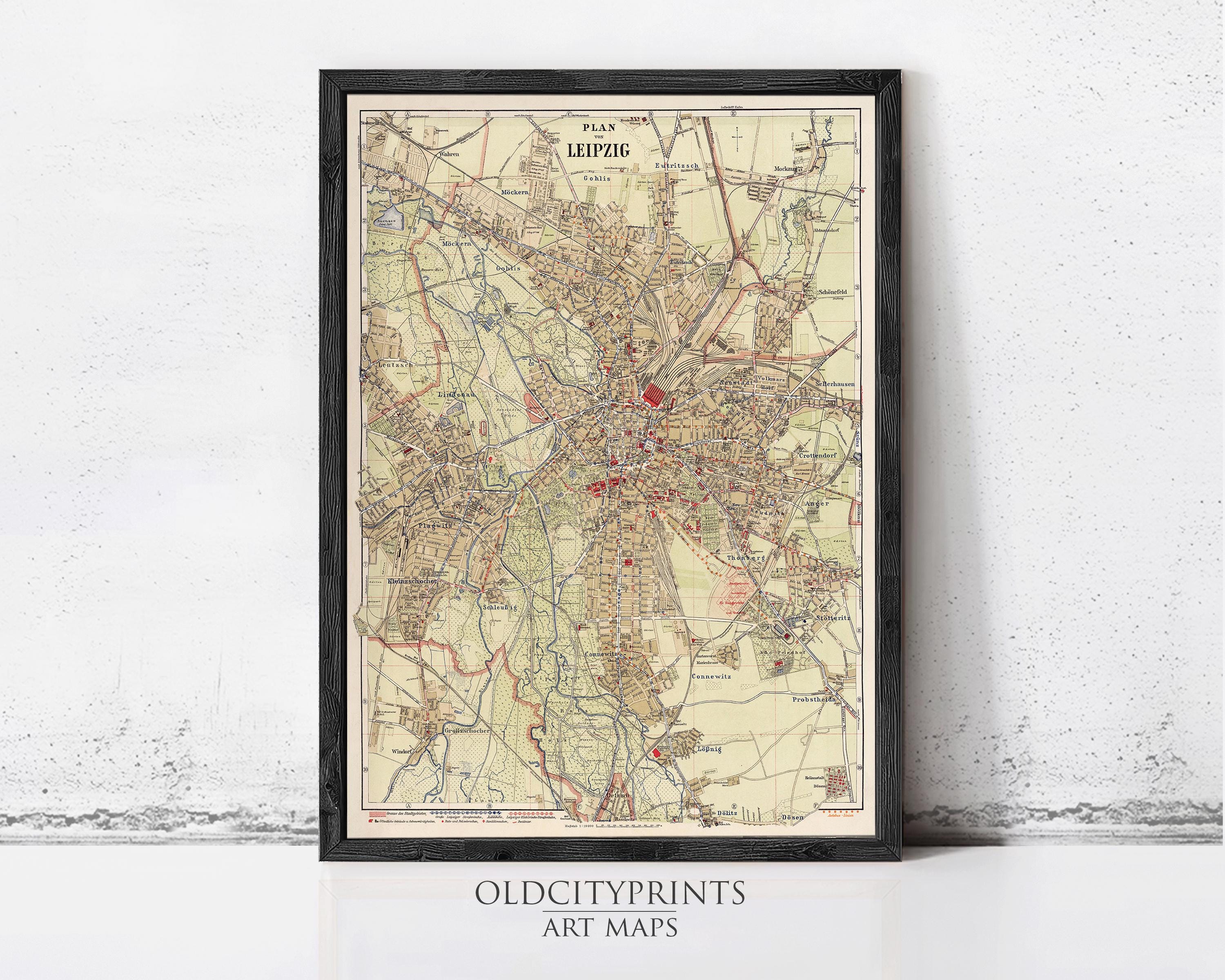 The image is a framed vintage map of Leipzig, Germany, depicting the city's streets and surrounding areas.