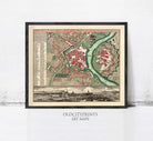The image is a framed vintage map of a city, depicting the layout of the city with streets, buildings, and other landmarks.