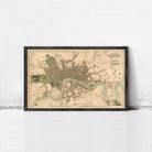 The image is a framed map of London, England, depicting the city's streets, landmarks, and surrounding areas.