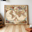 The image is a framed antique map of the world, featuring intricate illustrations and detailed cartography.