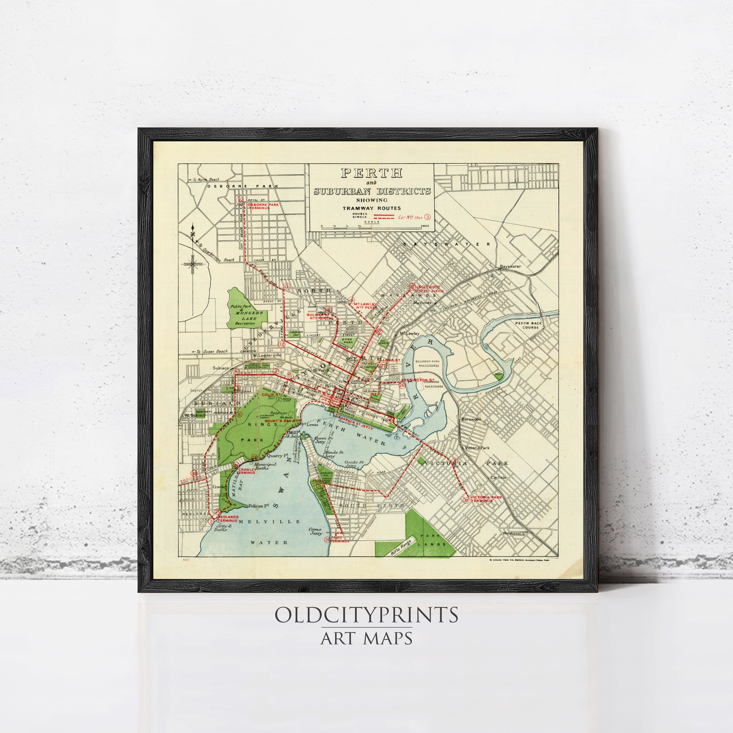 The image is a framed vintage map of the city of Perth, Australia, depicting the city's streets, parks, and other landmarks.