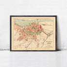 The image is a framed vintage map of a city, likely from the 19th century, depicting the city's layout and surrounding areas.
