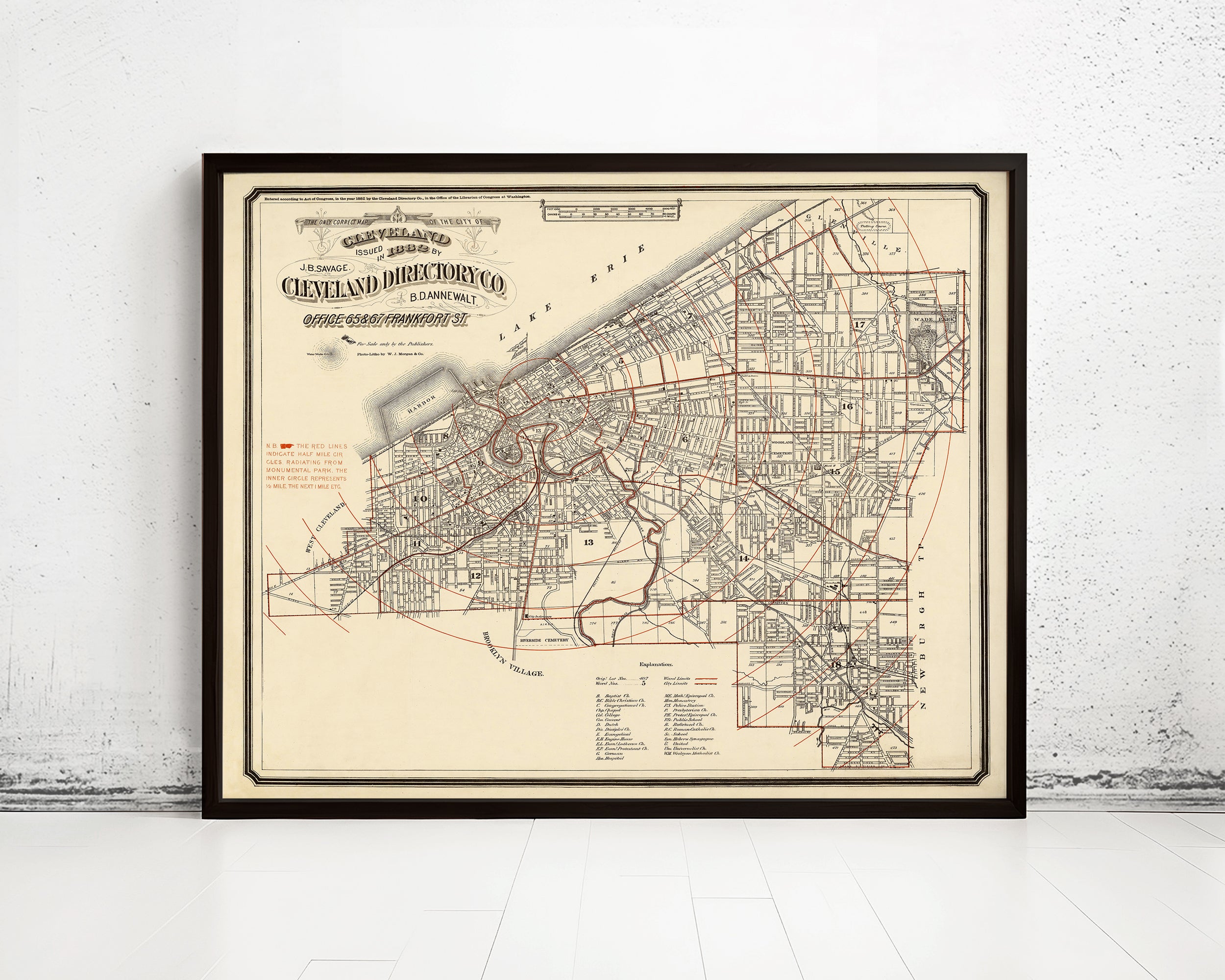 The image is a framed vintage map of Cleveland, Ohio, depicting the city's streets and neighborhoods.