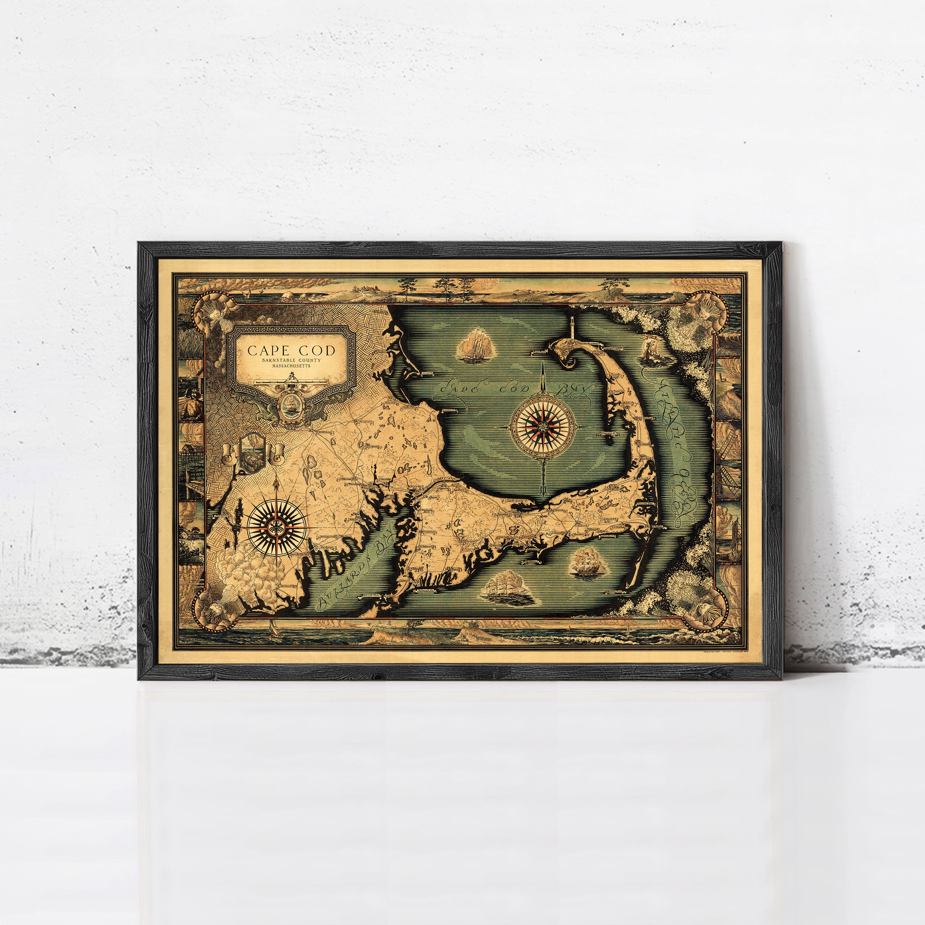 The image is a framed vintage map of Cape Cod, Massachusetts, depicting the coastline and surrounding areas in a detailed and ornate style.