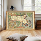 The image is a framed vintage map of Massachusetts, depicting various landmarks and regions within the state.
