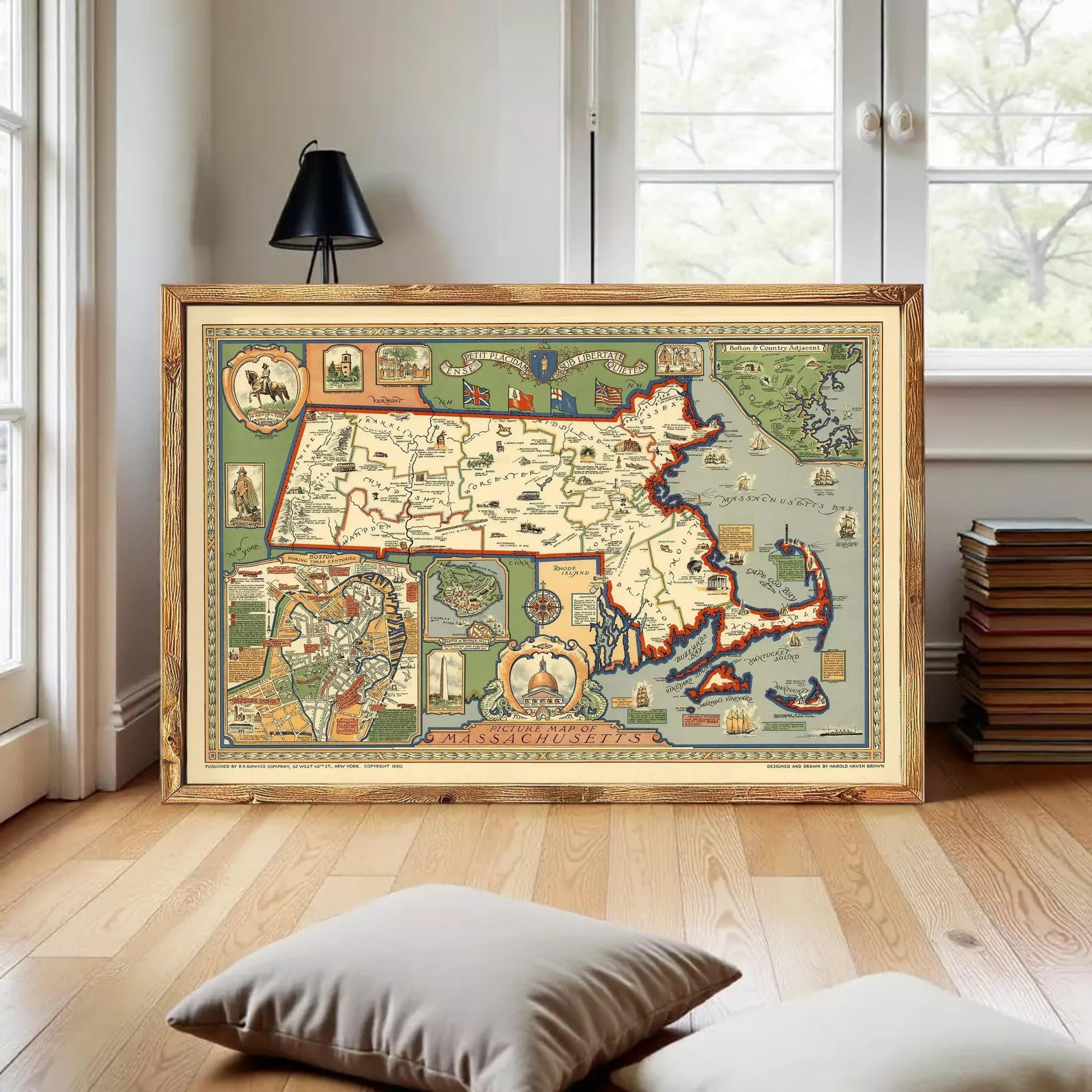 The image is a framed vintage map of Massachusetts, depicting various landmarks and regions within the state.