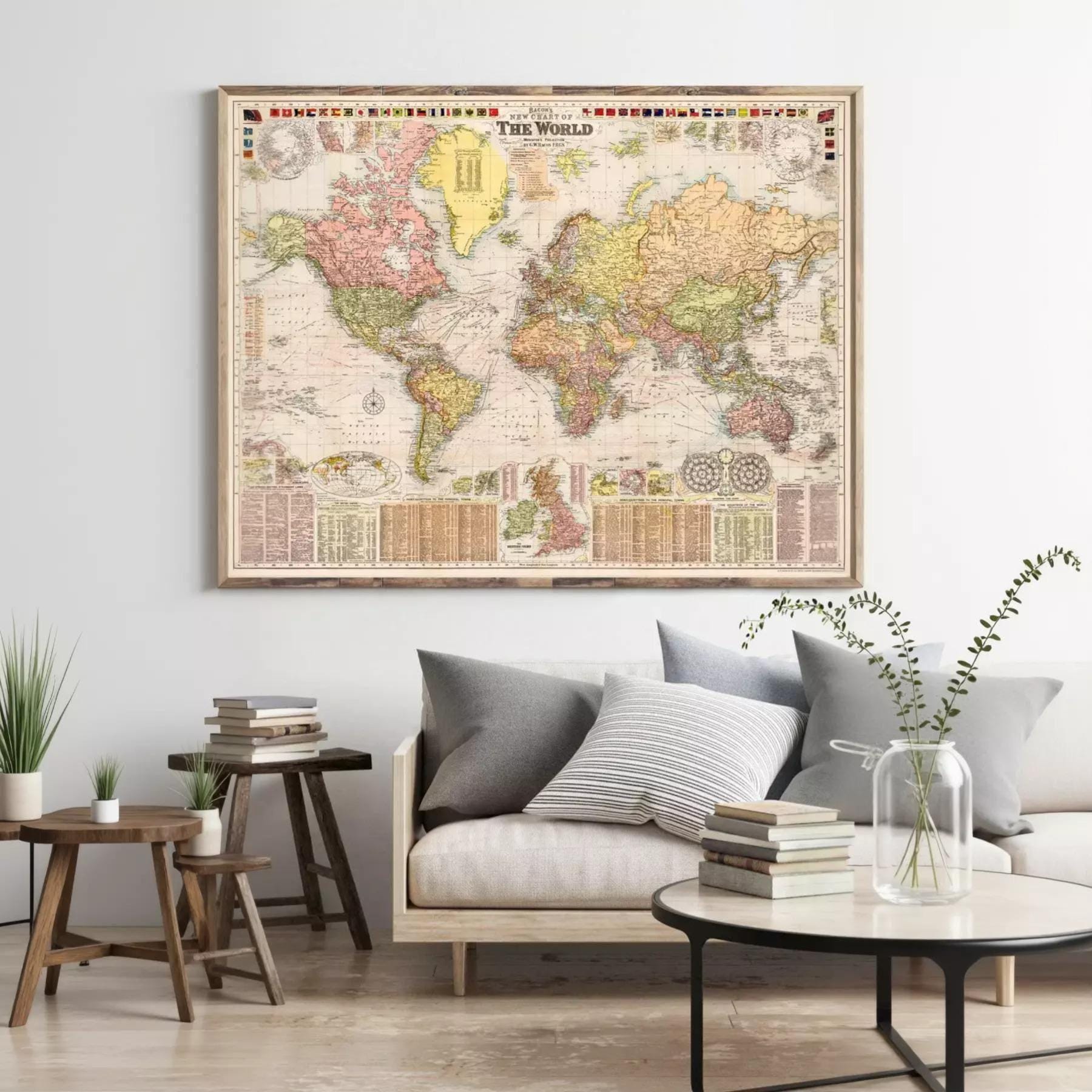 a large world map hanging on a wall, with a cozy living room setting below it.