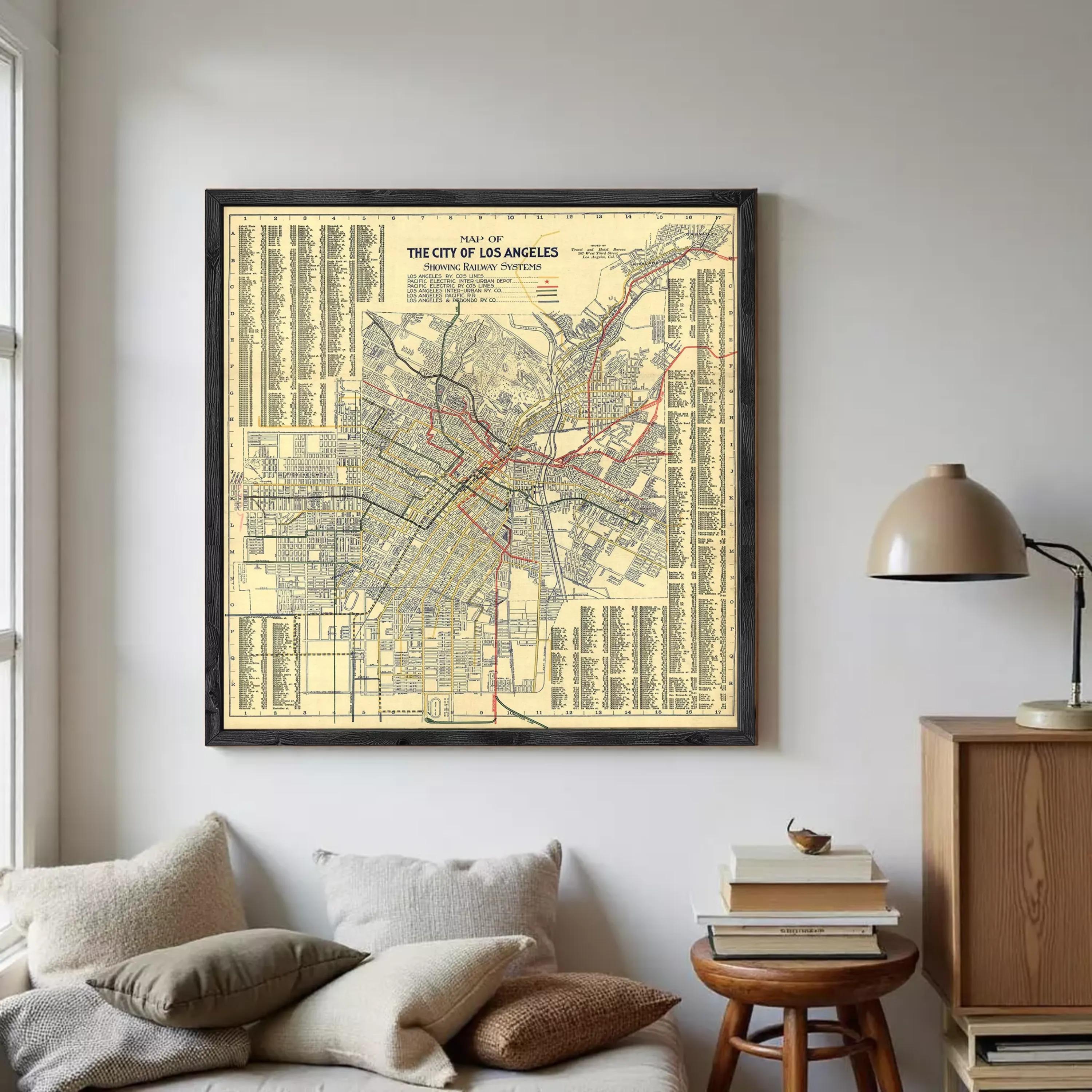 The image is a framed vintage map of Los Angeles, California, depicting the city's streets, neighborhoods, and transportation system.