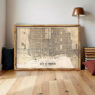 A framed map of Toronto, Canada, depicting the city's streets and landmarks.