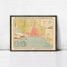 The image is a framed map of a coastal city, depicting the city's layout, surrounding areas, and possibly a harbor.