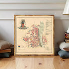 The image is a framed map of a city, likely from the past, with a coat of arms and various labels indicating different locations and landmarks within the city.
