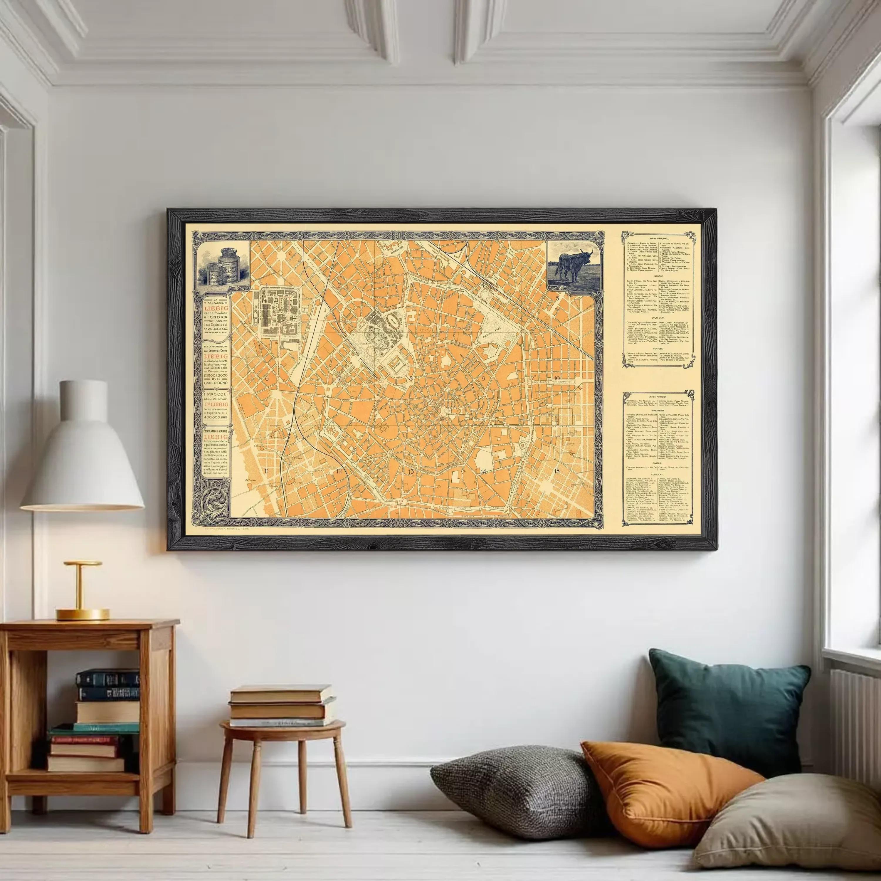 The image is a framed vintage map of a city, likely from the 19th century, displayed on a white wall.