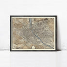 The image is a framed map of a city, likely Paris, with a detailed and intricate layout of streets, rivers, and other landmarks.