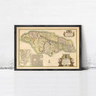 The image is a framed vintage map of Jamaica, featuring detailed geographical information and a decorative border.