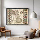 The image is a framed vintage map of the United Kingdom, featuring intricate illustrations and detailed cartography.