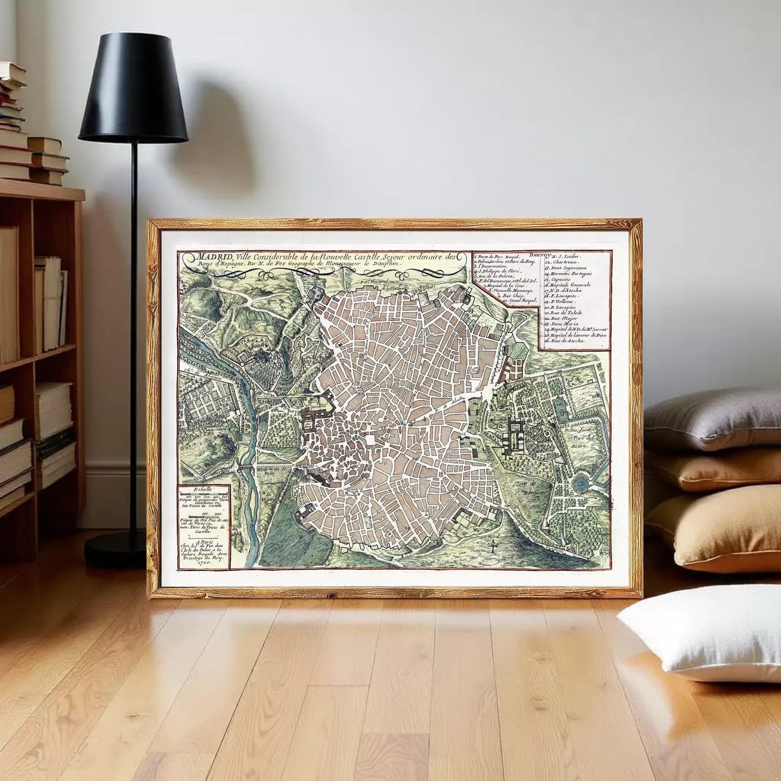The image is a framed vintage map of a city, likely from the 16th century, with detailed street and landscape illustrations.