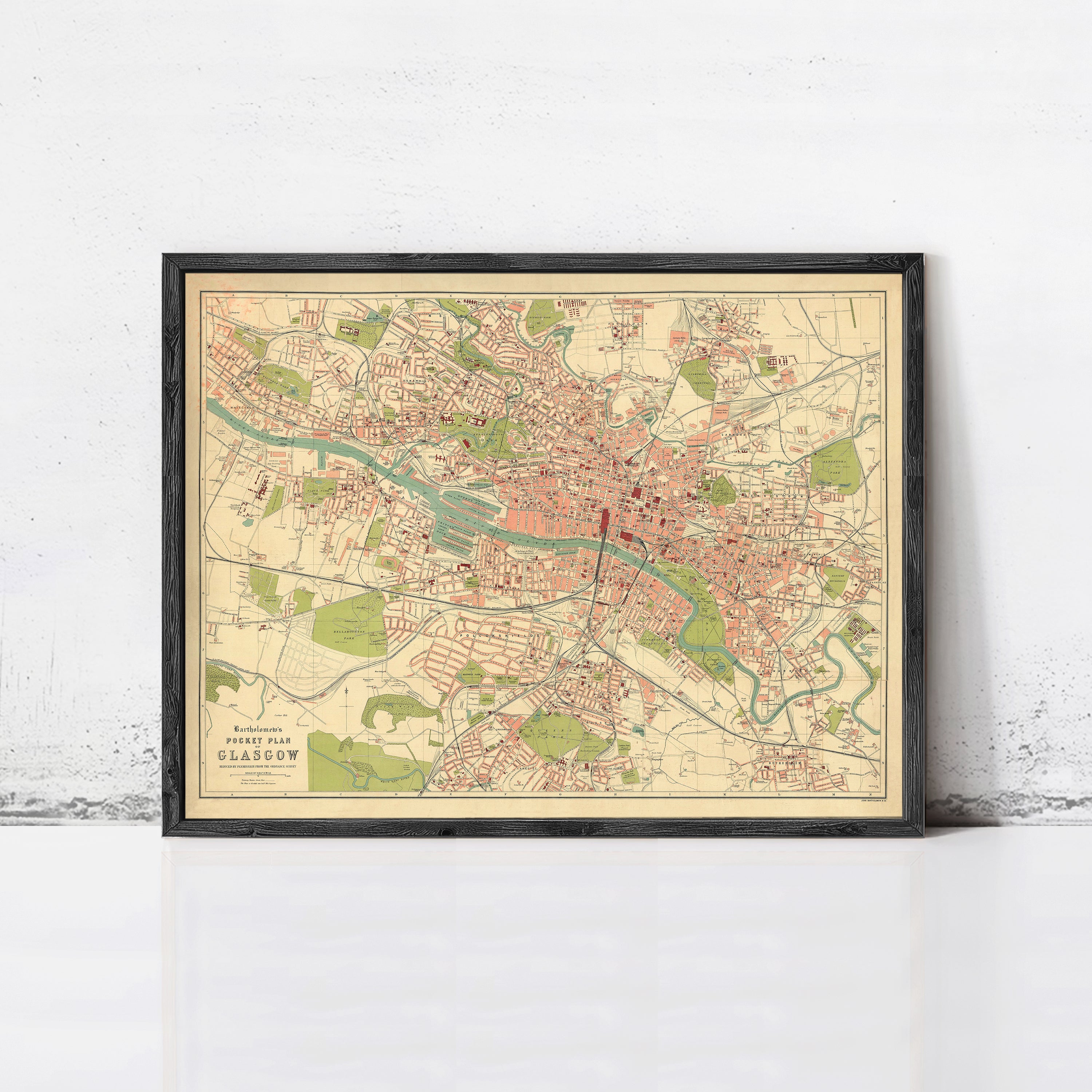 The image is a framed vintage map of a city, likely London, with various streets, landmarks, and neighborhoods depicted.