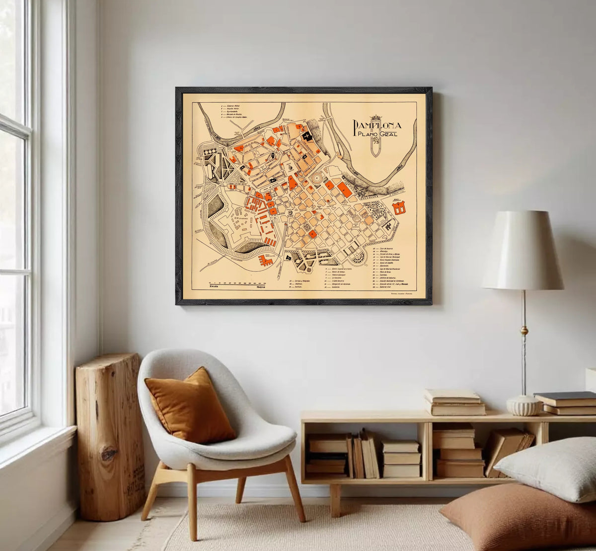 The image is a framed map of the city of Pamplona, Spain, depicting the layout and various landmarks within the city.