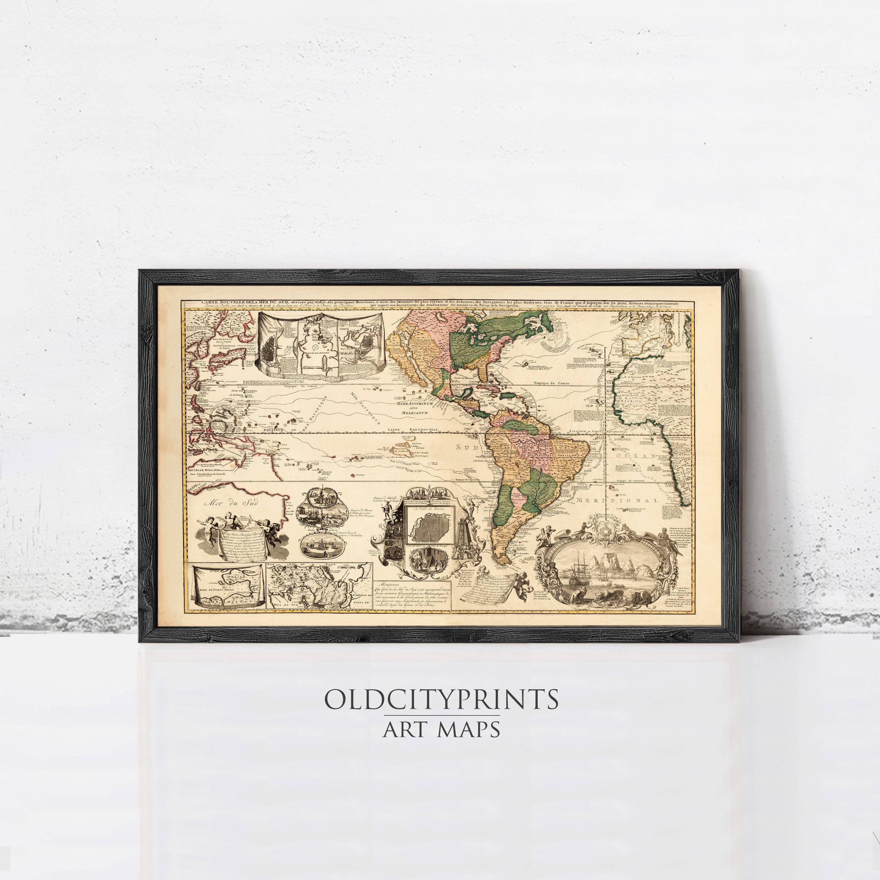 The image is a framed antique map of the world, depicting various regions and landmarks.