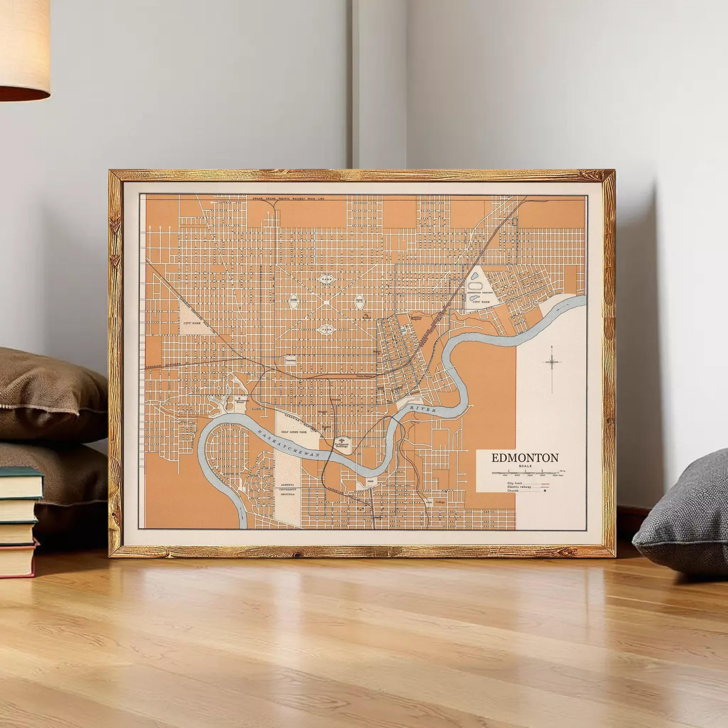a framed map of Edmonton, Canada, with a wooden frame and a light brown color. The map appears to be a vintage or historical representation of the city.
