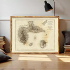 a large, framed map of the Guadeloupe archipelago, which is a group of islands located in the Caribbean Sea.