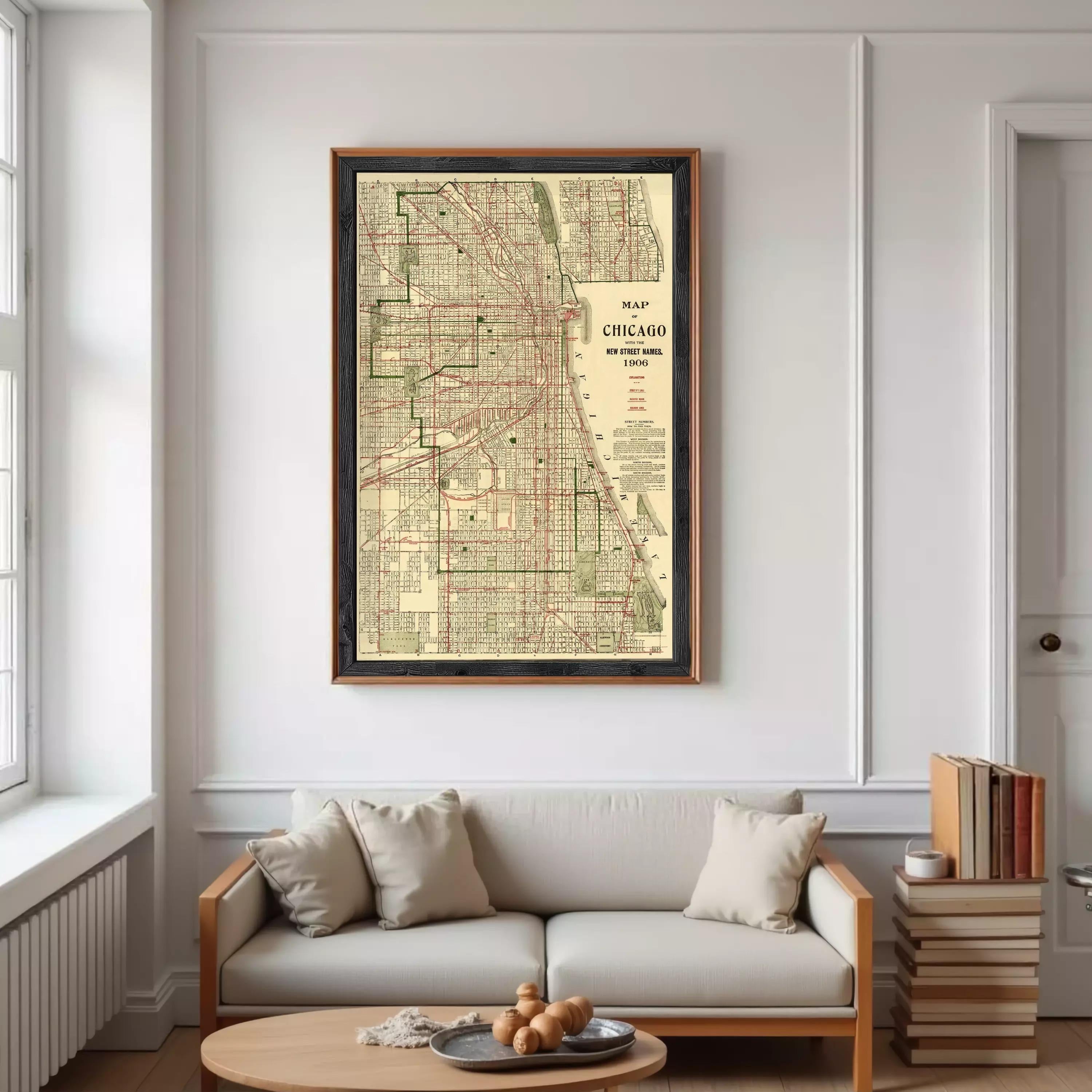 a large framed map of Chicago hanging on a white wall in a living room.