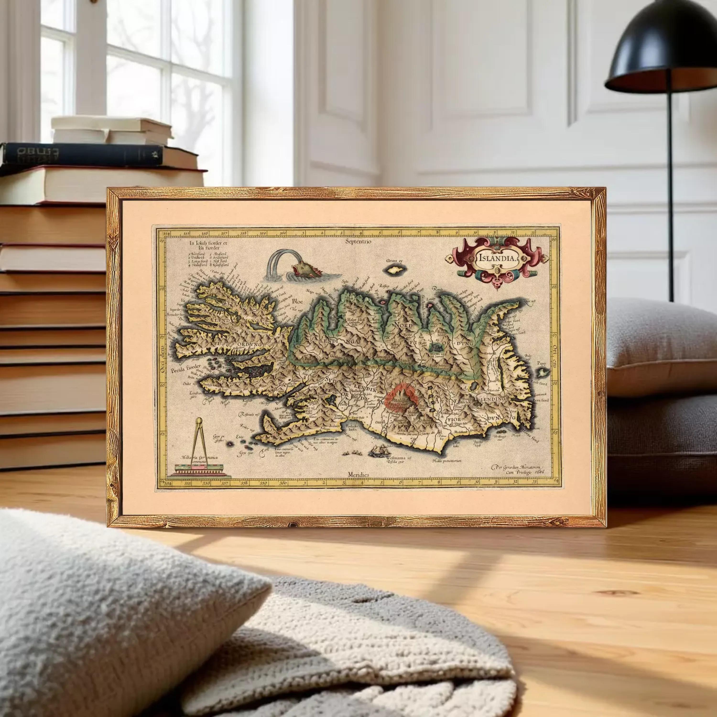The image is a framed vintage map of Iceland, featuring detailed illustrations and labels.
