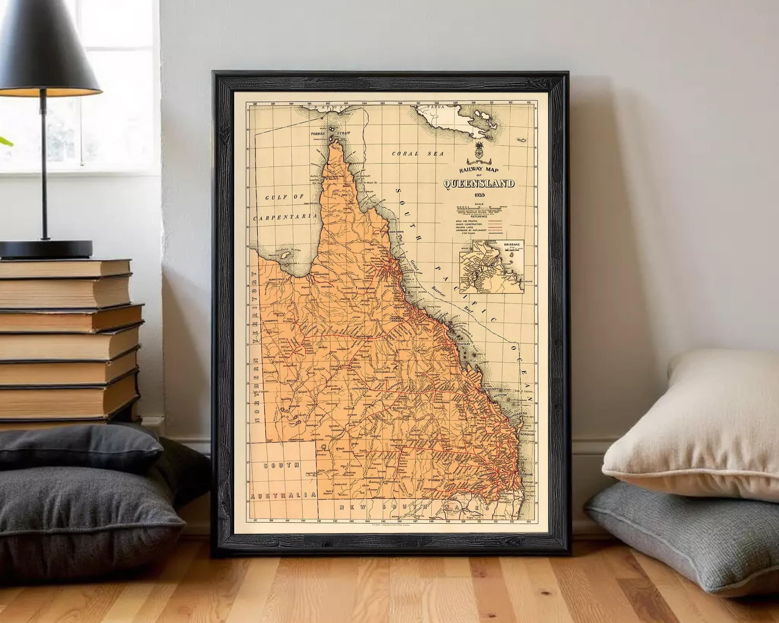The image is a framed vintage map of the Queensland region of Australia, depicting the state's geographical layout and boundaries.