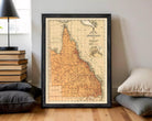 The image is a framed vintage map of the Queensland region of Australia, depicting the state's geographical layout and boundaries.