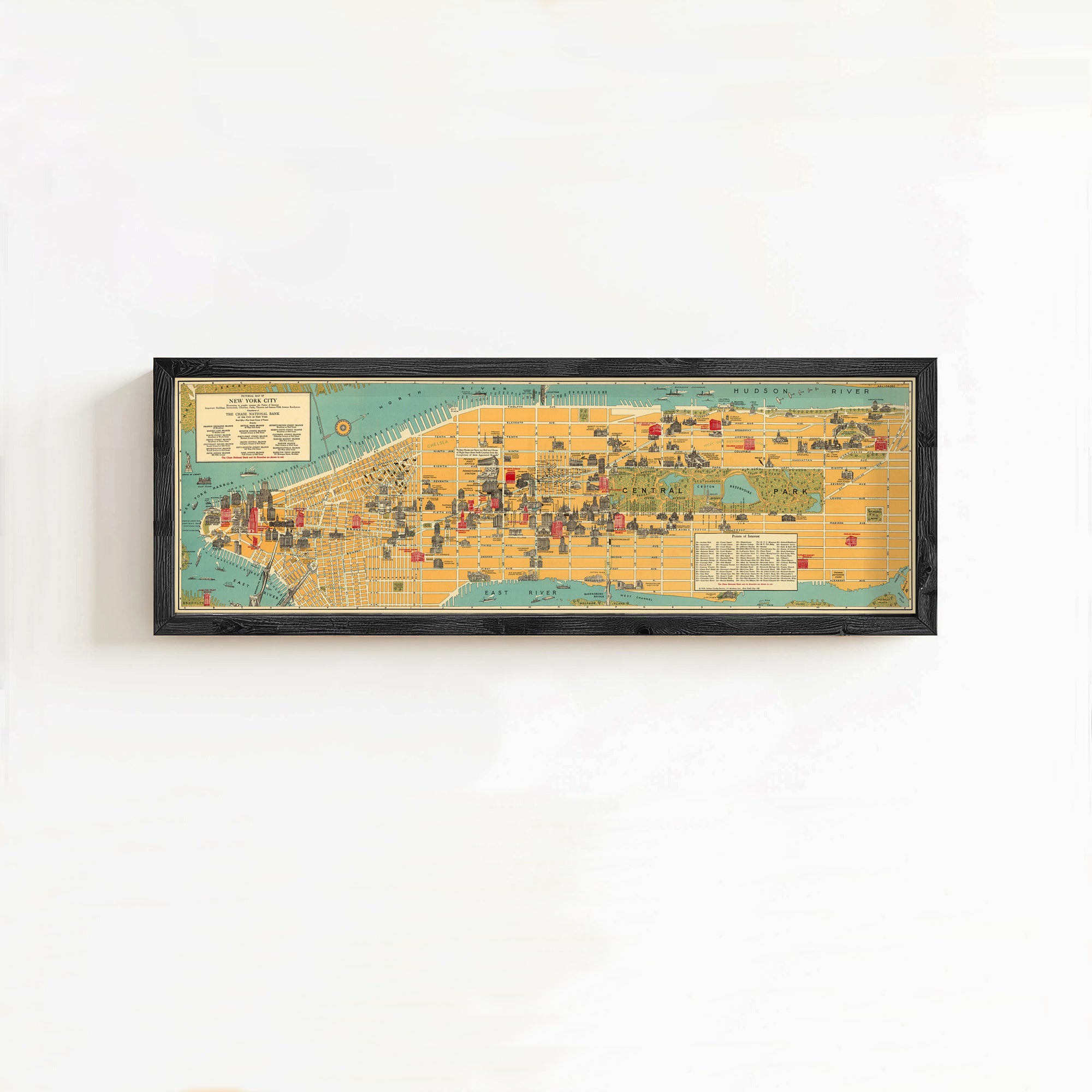 The image is a framed map of New York City, depicting various landmarks and locations within the city.