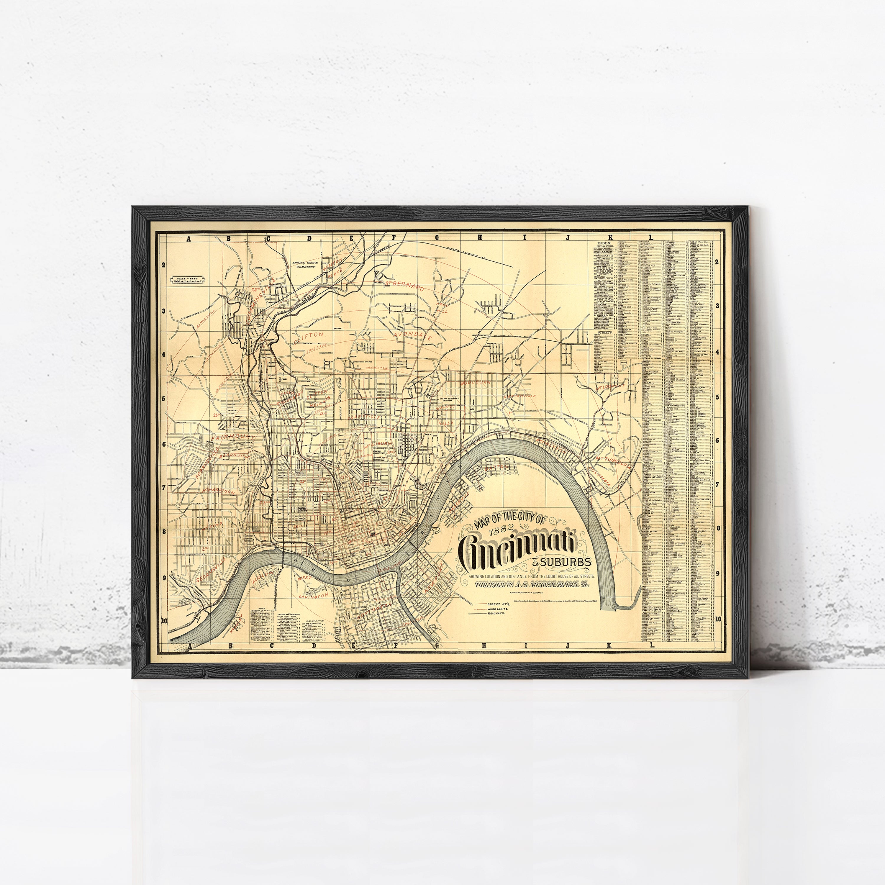 The image is a framed vintage map of Cincinnati, Ohio, showing the city's streets and surrounding areas.