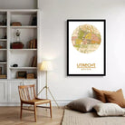A framed map of Urecht, a city in Germany, with a circular design and various colored areas representing different neighborhoods or districts.