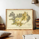 a large framed map of Iceland, with a wooden frame and a vintage-style design.