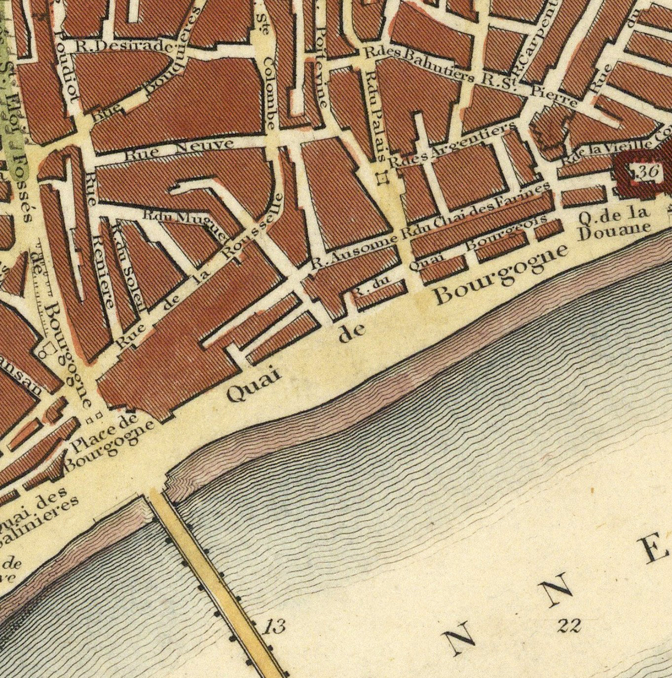The image is a detailed map of a city, showing streets, buildings, and a body of water.