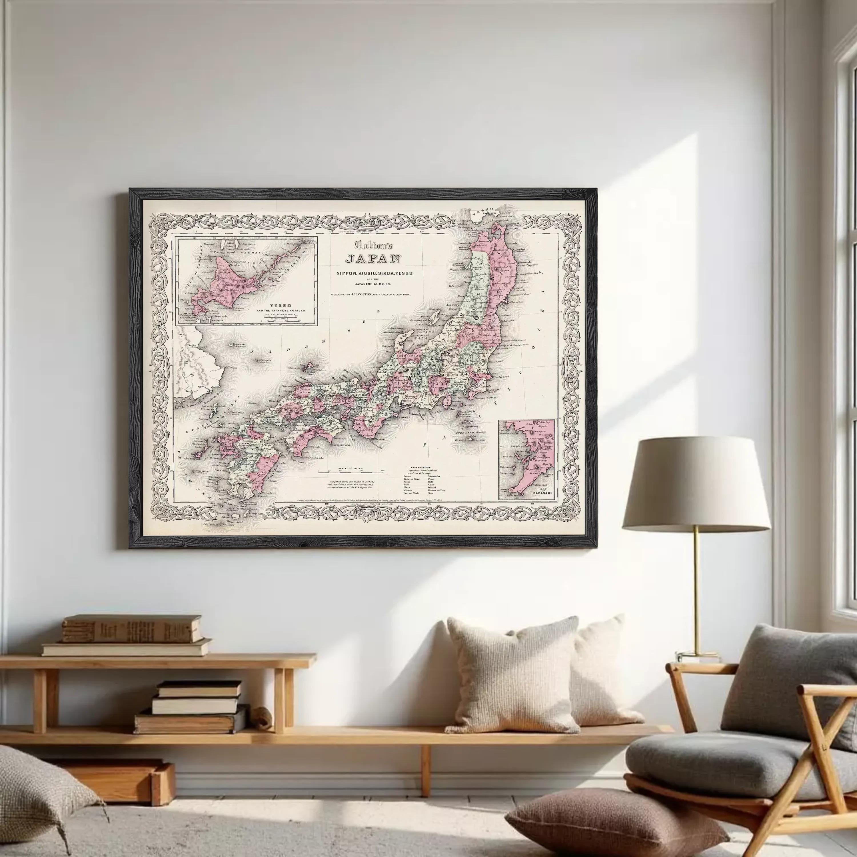 The image is a framed vintage map of Japan, depicting the country in pink and white colors.