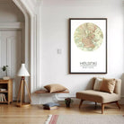 a cozy living room with a large map of Helsinki hanging on the wall, a wooden bench, a beige armchair, and a lamp.