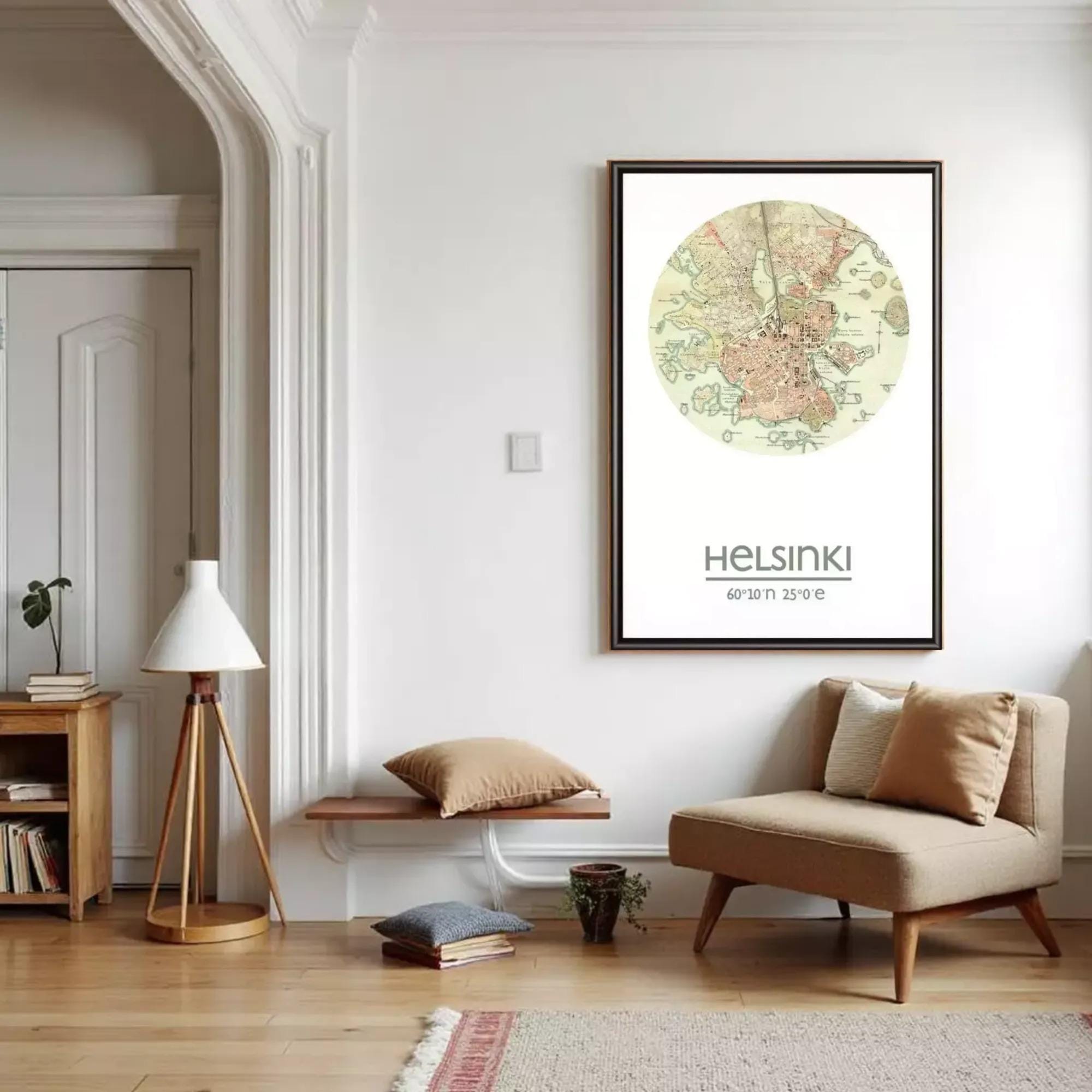 a cozy living room with a large map of Helsinki hanging on the wall, a wooden bench, a beige armchair, and a lamp.
