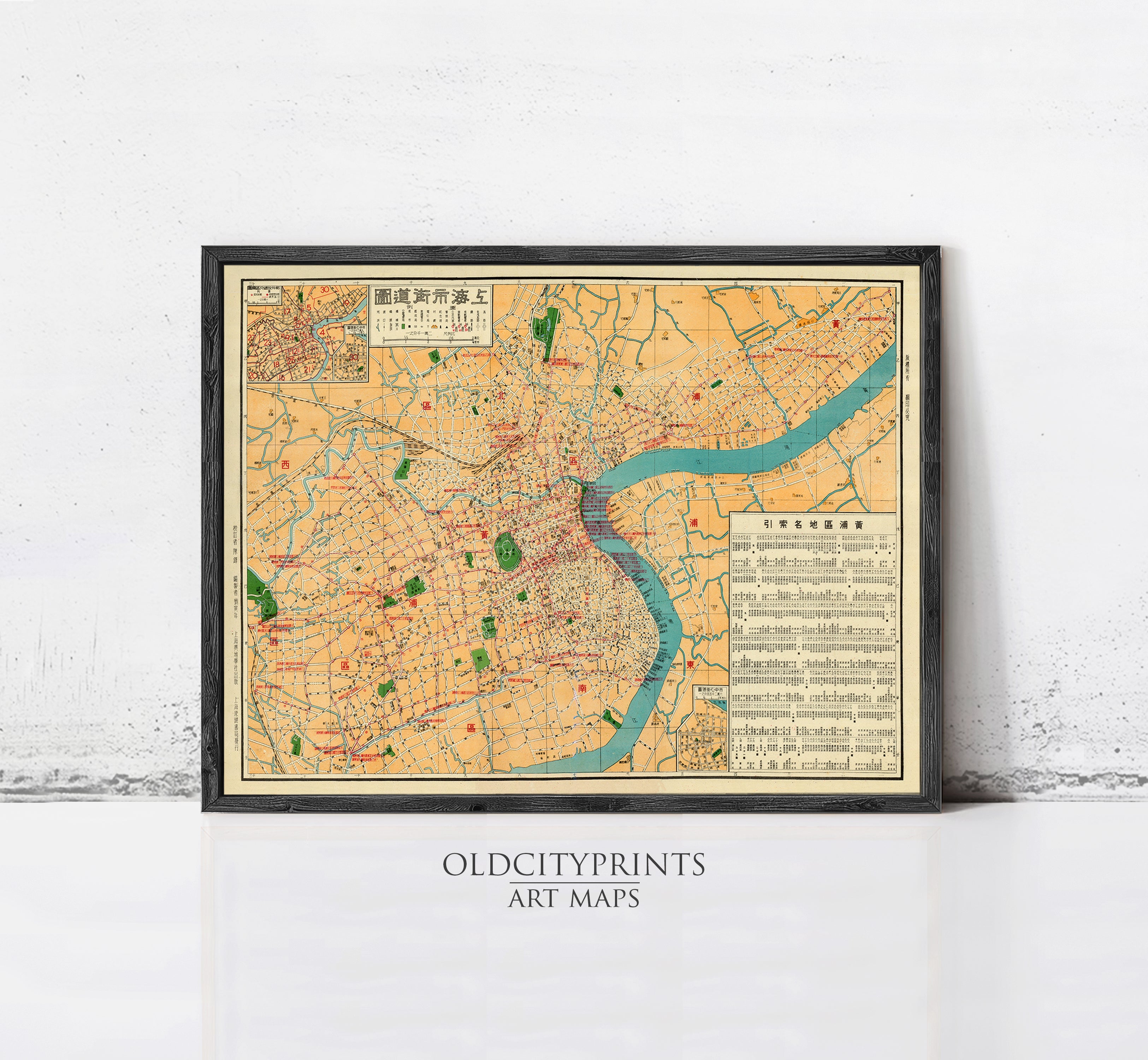 The image is a framed vintage map of a city, likely from the early 20th century, with a focus on the urban layout and transportation routes.