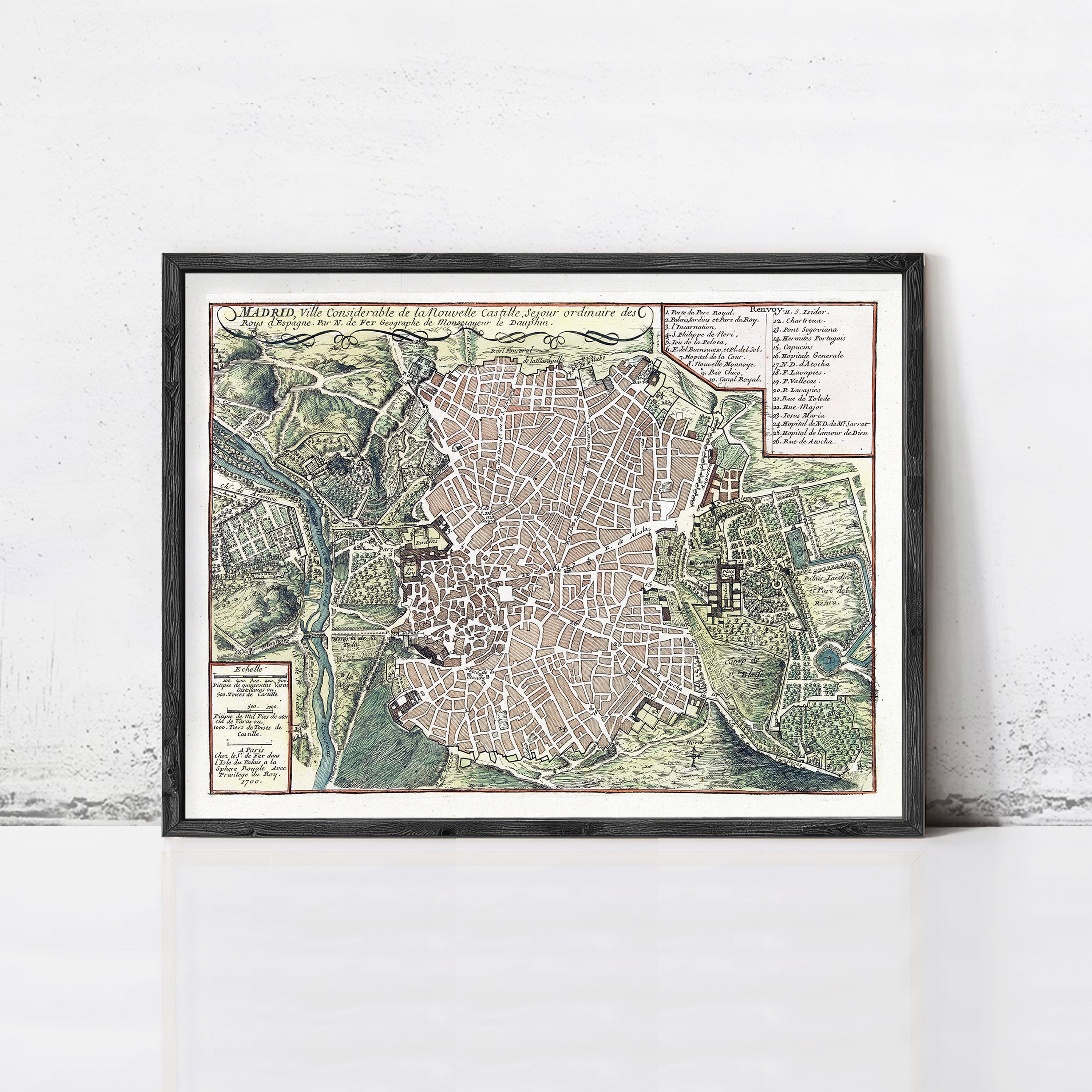 The image is a framed map of a city, likely displaying a detailed layout of streets, landmarks, and other geographical features.