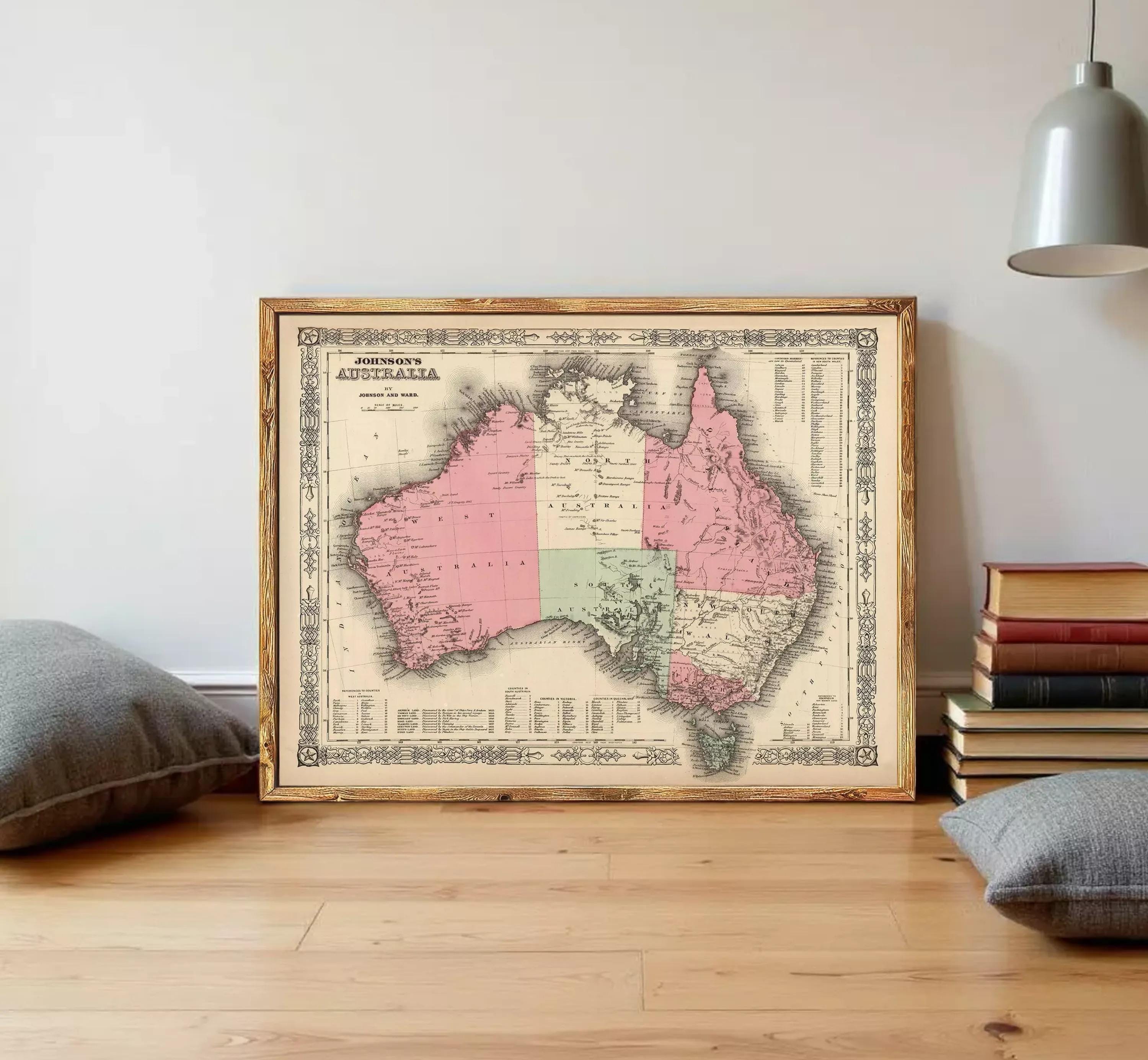 The image is a framed vintage map of Australia, depicting the country in a detailed and intricate manner.