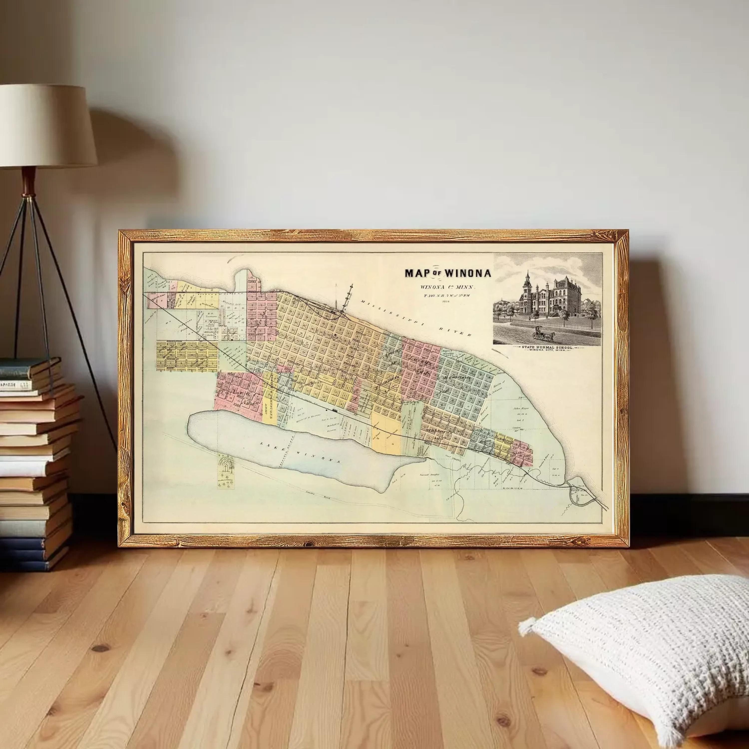 The image is a framed vintage map of Winona, Minnesota, depicting the city's layout and surrounding areas.