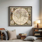The image is a framed antique map of the world, featuring intricate details and decorative elements.