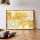 The image is a framed map of a city, likely Caen, with various streets, landmarks, and other geographical features depicted.