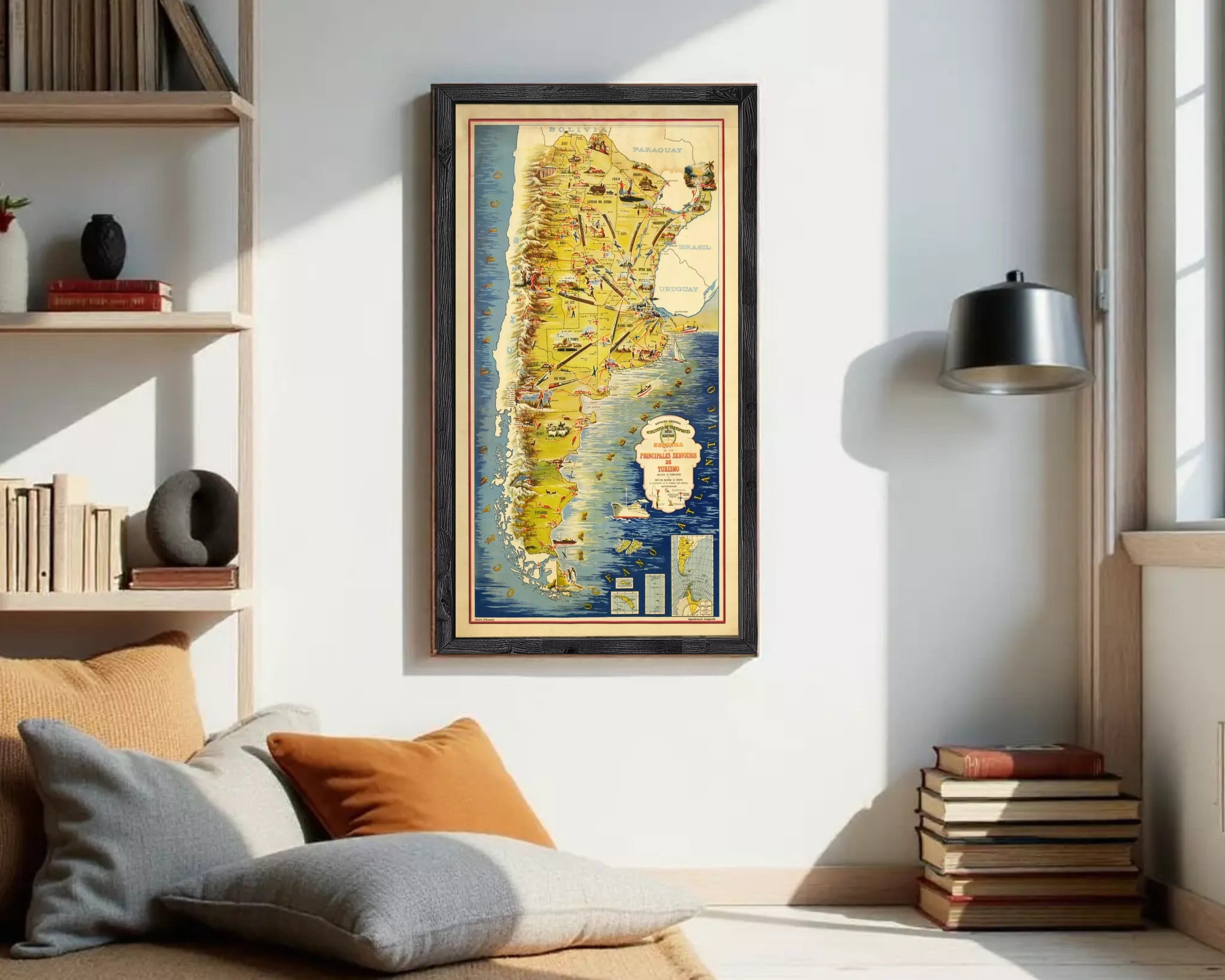 The image is a framed vintage map of South America, featuring various countries and regions with labels and illustrations.