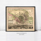 The image is a framed vintage map of a city, depicting the layout of the city and surrounding areas.